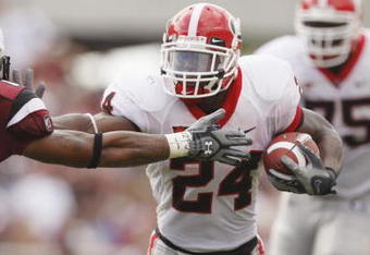 COLUMBIA, SC - SEPTEMBER 13:  Knowshon Moreno #24 of the Georgia Bulldogs runs the ball against Emanuel Cook #21 of the South Carolina Gamecocks during their game at Williams-Brice Stadium in Columbia, South Carolina on September 13, 2008.  (Photo by Streeter Lecka/Getty Images)