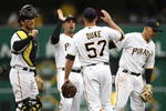 PITTSBURGH - APRIL 13:  Zach Duke #57 of the Pittsburgh Pirates is congratulated by Ryan Doumit #41, Ramon Vazquez #5 and Jack Wilson #2 after throwing a complete game and beating the Houston Astros 7-0 during the Pirates Home Opener at PNC Park April 13, 2009 in Pittsburgh, Pennsylvania.  (Photo by Gregory Shamus/Getty Images)