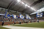 DETROIT - SEPTEMBER 30: Cheer squad carries flags on the field before the game between the Detroit Lions and the Chicago Bears on September 30, 2007 at Ford Field in Detroit, Michigan. The Lions defeated the Bears 37-27. (Photo by Jonathan Daniel/Getty Images)