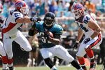 JACKSONVILLE, FL - SEPTEMBER 14:  Maurice Jones-Drew #32 of the Jacksonville Jaguars runs past  Paul Posluszny #51 and Aaron Schobel #94 of the Buffalo Bills at Jacksonville Municipal Stadium on September 14, 2008 in Jacksonville, Florida.  (Photo by Sam Greenwood/Getty Images)