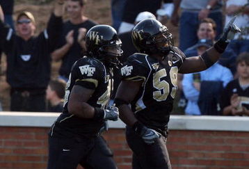 WINSTON SALEM, NC - OCTOBER 27:  Aaron Curry #59 of the Wake Forest Demon Deacons celebrates his touchdown against the UNC Tar Heels during the ACC game at the Groves Stadium on October 27, 2007 in Winston Salem,North Carolina.  (Photo by David Cannon/Getty Images)