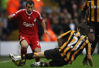LIVERPOOL, UNITED KINGDOM - DECEMBER 13:  Javier Mascherano of Liverpool is challenged by Sam Ricketts of Hull City during the Barclays Premier League match between Liverpool and Hull City at Anfield on December 13, 2008 in Liverpool, England. (Photo by Hamish Blair/Getty Images)
