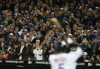FLUSHING, NY - APRIL 13:  Fans watch as David Wright #5 of the New York Mets bats against the San Diego Padres during opening day at Citi Field on April 13, 2009 in the Flushing neighborhood of the Queens borough of New York City. This is the first regular season MLB game being played at the new venue which replaced Shea Stadium as the Mets home field.  (Photo by Nick Laham/Getty Images)