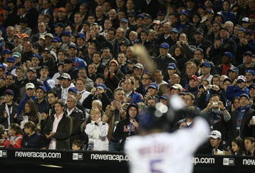 FLUSHING, NY - APRIL 13:  Fans watch as David Wright #5 of the New York Mets bats against the San Diego Padres during opening day at Citi Field on April 13, 2009 in the Flushing neighborhood of the Queens borough of New York City. This is the first regular season MLB game being played at the new venue which replaced Shea Stadium as the Mets home field.  (Photo by Nick Laham/Getty Images)