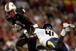 COLLEGE PARK, MD - SEPTEMBER 13:  Receiver Darrius Heyward-Bey #8 of the Maryland Terrapins evades Eric Wicks #41 of the West Virginia Mountaineers after making a reception during the 1st quarter of the game on September 13, 2007 at Byrd Stadium in College Park, Maryland.  (Photo by Jamie Squire/Getty Images)