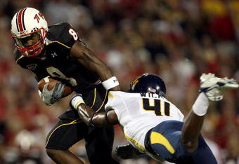 COLLEGE PARK, MD - SEPTEMBER 13:  Receiver Darrius Heyward-Bey #8 of the Maryland Terrapins evades Eric Wicks #41 of the West Virginia Mountaineers after making a reception during the 1st quarter of the game on September 13, 2007 at Byrd Stadium in College Park, Maryland.  (Photo by Jamie Squire/Getty Images)