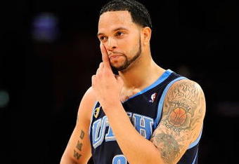 LOS ANGELES, CA - APRIL 21:  Deron Williams #8 of the Utah Jazz wipes his face in the second half against the Los Angeles Lakers in Game Two of the Western Conference Quarterfinals during the 2009 NBA Playoffs at Staples Center on April 21, 2009 in Los Angeles, California. NOTE TO USER: User expressly acknowledges and agrees that, by downloading and or using this photograph, User is consenting to the terms and conditions of the Getty Images License Agreement.  (Photo by Kevork Djansezian/Getty Images)