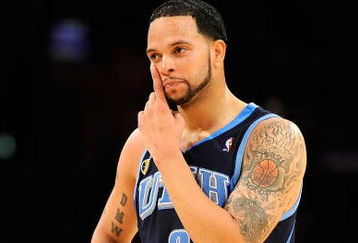 LOS ANGELES, CA - APRIL 21:  Deron Williams #8 of the Utah Jazz wipes his face in the second half against the Los Angeles Lakers in Game Two of the Western Conference Quarterfinals during the 2009 NBA Playoffs at Staples Center on April 21, 2009 in Los Angeles, California. NOTE TO USER: User expressly acknowledges and agrees that, by downloading and or using this photograph, User is consenting to the terms and conditions of the Getty Images License Agreement.  (Photo by Kevork Djansezian/Getty Images)