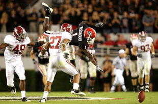 ATHENS, GA - SEPTEMBER 27:  Receiver Mohamed Massaquoi #1 of the Georgia Bulldogs drops the ball as he is hit by Justin Woodall #27 and Rashad Johnson #49 of the Alabama Crimson Tide at Sanford Stadium on September 27, 2008 in Athens, Georgia. Alabama defeated Georgia 41-30.  (Photo by Doug Benc/Getty Images)