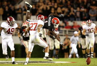 ATHENS, GA - SEPTEMBER 27:  Receiver Mohamed Massaquoi #1 of the Georgia Bulldogs drops the ball as he is hit by Justin Woodall #27 and Rashad Johnson #49 of the Alabama Crimson Tide at Sanford Stadium on September 27, 2008 in Athens, Georgia. Alabama defeated Georgia 41-30.  (Photo by Doug Benc/Getty Images)