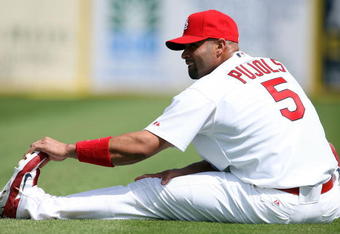 JUPITER, FL - FEBRUARY 25:  Albert Pujols #5 of the St. Louis Cardinals stretches before taking on the Florida Marlins during a spring training game at Roger Dean Stadium February 25, 2009 in Jupiter, Florida.  (Photo by Doug Benc/Getty Images)