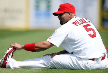 JUPITER, FL - FEBRUARY 25:  Albert Pujols #5 of the St. Louis Cardinals stretches before taking on the Florida Marlins during a spring training game at Roger Dean Stadium February 25, 2009 in Jupiter, Florida.  (Photo by Doug Benc/Getty Images)