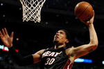 CHICAGO - FEBRUARY 12: Michael Beasley #30 of the Miami Heat puts up a shot against the Chicago Bulls on February 12, 2009 at the United Center in Chicago, Illinois. The Heat defeated the Bulls 95-93. NOTE TO USER: User expressly acknowledges and agreees that, by downloading and/or using this Photograph, User is consenting to the terms and conditions of the Getty Images License Agreement. (Photo by Jonathan Daniel/Getty Images)