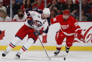 DETROIT - APRIL 18: Rick Nash #61 of the Columbus Blue Jackets tries to get around Brian Rafalski #28 of the Detroit Red Wings during Game Two of the Western Conference Quarterfinals of the 2009 NHL Stanley Cup Playoffs on April 18, 2009 at Joe Louis Arena in Detroit, Michigan.  (Photo by Gregory Shamus/Getty Images)