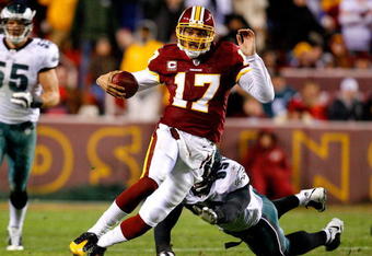 LANDOVER, MD - DECEMBER 21:  Quarterback Jason Campbell #17 of the Washington Redskins rushes upfield away from Victor Abiamiri #95 of the Philadelphia Eagles during the game on December 21, 2008 at FedEx Field in Landover, Maryland.  (Photo by Kevin C. Cox/Getty Images)
