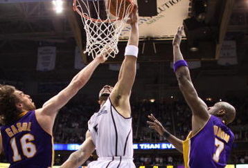 SALT LAKE CITY - APRIL 23:  Carlos Boozer #5 of the Utah Jazz dunks over Pau Gasol #16 of the Los Angeles Lakers in Game Three of the Western Conference Quarterfinals during the 2009 NBA Playoffs at Energy Solutions Arena on April 23, 2009 in Salt Lake City, Utah. The Jazz defeated the Lakers 88-86. NOTE TO USER: User expressly acknowledges and agrees that, by downloading and/or using this Photograph, user is consenting to the terms and conditions of the Getty Images License Agreement. Mandatory Copyright Notice: Copyright 2009 Getty Images (Photo by Otto Greule Jr/Getty Images)