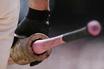 SAN FRANCISCO - MAY 14:  A San Francisco Giants player holds one of the pink Louisville Slugger bats that were distributed as part of MLB's 'Go to Bat Against Breast Cancer' promotion during the game against the Los Angeles Dodgers at AT&T Park May 14, 2006 in San Francisco, California.  (Photo by Jonathan Ferrey/Getty Images)