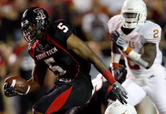 LUBBOCK, TX - NOVEMBER 01:  Michael Crabtree #5 of the Texas Tech Red Raiders carries the ball after making a reception during the first half of the game against the Texas Longhorns on November 1, 2008 at Jones Stadium in Lubbock, Texas.  (Photo by Jamie Squire/Getty Images)