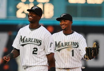 MIAMI - APRIL 06:  Emilio Bonifacio #1 and Hanley Ramirez #2 of the Florida Marlins celebrate their teams' victory over the Washington Nationals on opening day at Dolphin Stadium on April 6, 2009 in Miami, Florida. The Marlins defeated the Nationals 12-5.  (Photo by Doug Benc/Getty Images)
