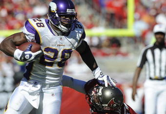 TAMPA, FL - NOVEMBER 16: Running back Adrian Peterson #28 of the Minnesota Vikings rushes upfield against the Tampa Bay Buccaneers at Raymond James Stadium on November 16, 2008 in Tampa, Florida.  (Photo by Al Messerschmidt/Getty Images) 