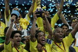 FRANKFURT, GERMANY - JUNE 29:  Ronaldinho, captain of Brazil, lifts the trophy following the FIFA 2005 Confederations Cup Final between Brazil and Argentina at the Waldstadion June 29, 2005, in Frankfurt, Germany.  (Photo by Ben Radford/Getty Images)