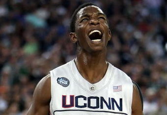 DETROIT - APRIL 04:  Hasheem Thabeet #34 of the Connecticut Huskies reacts after he scored a basket in the first half against the Michigan State Spartans during the National Semifinal game of the NCAA Division I Men's Basketball Championship at Ford Field on April 4, 2009 in Detroit, Michigan.  (Photo by Gregory Shamus/Getty Images)