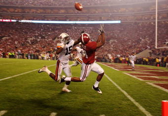 TUSCALOOSA, AL - NOVEMBER 29:  Wide receiver Marquis Maze #4 of the Alabama Crimson Tide makes a touchdown catch over defensive back Neiko Thorpe #15 of the Auburn Tigers at Bryant-Denny Stadium on November 29, 2008 in Tuscaloosa, Alabama. Alabama defeated Auburn 36-0.  (Photo by Doug Benc/Getty Images)
