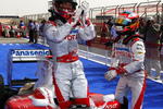SAKHIR, BAHRAIN - APRIL 25:  Jarno Trulli (L) of Italy and Toyota celebrates with second placed team mate Timo Glock (R) of Germany and Toyota in parc ferme after taking pole position during qualifying for the Bahrain Formula One Grand Prix at the Bahrain International Circuit on April 25, 2009 in Sakhir, Bahrain.  (Photo by Clive Mason/Getty Images)