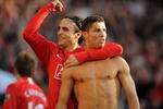 MANCHESTER, ENGLAND - APRIL 25:  Cristiano Ronaldo (R) of Manchester United is congratulated by team mate Dimitar Berbatov after scoring his team's third goal during the Barclays Premier League match between Manchester United and Tottenham Hotspur at Old Trafford on April 25, 2009 in Manchester, England.  (Photo by Shaun Botterill/Getty Images)