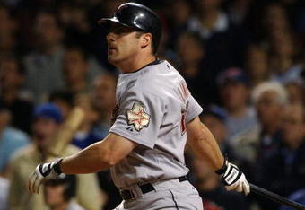 CHICAGO - JUNE 1:  Pinch hitter Michael Lamb #26 of the Houston Astros hits a two-run double in the eighth inning, scoring the winning runs against the Chicago Cubs June 1, 2004 at Wrigley Field in Chicago, Illinois. The Astros defeated the Cubs 5-3.  (Photo by Jonathan Daniel/Getty Images)