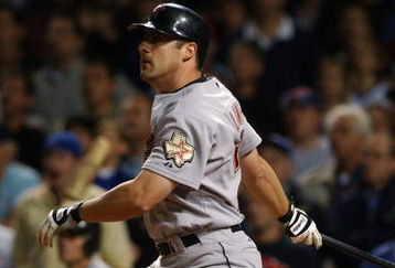 CHICAGO - JUNE 1:  Pinch hitter Michael Lamb #26 of the Houston Astros hits a two-run double in the eighth inning, scoring the winning runs against the Chicago Cubs June 1, 2004 at Wrigley Field in Chicago, Illinois. The Astros defeated the Cubs 5-3.  (Photo by Jonathan Daniel/Getty Images)