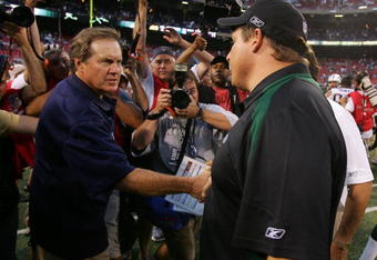 EAST RUTHERFORD, NJ - SEPTEMBER 14: Head coach Eric Mangini (R) of the New York Jets congratulates head coach Bill Belichick of the New England Patriots after their game on September 14, 2008 at Giants Stadium in East Rutherford, New Jersey. The Patriots defeated the Jets 19-10.  (Photo by Jim McIsaac/Getty Images)