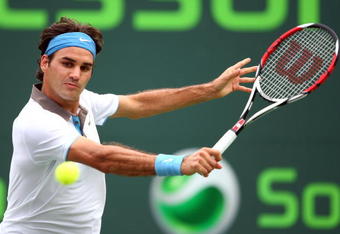 KEY BISCAYNE, FL - MARCH 29:  Roger Federer of Switzerland returns a shot against Nicolas Kiefer of Germany during the third round of the Sony Ericsson Open at the Crandon Park Tennis Center on March 29, 2009 in Key Biscayne, Florida.  (Photo by Clive Brunskill/Getty Images)