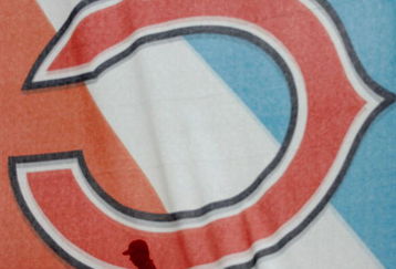 MIAMI GARDENS, FL - FEBRUARY 04:  A fan walks behind a Chicago Bears banner as he enters the stadium prior to the start of Super Bowl XLI between the Chicago Bears and the Indianapolis Colts on February 4, 2007 at Dolphin Stadium in Miami Gardens, Florida.  (Photo by Donald Miralle/Getty Images)