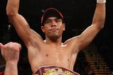 LAS VEGAS - DECEMBER 06:  (L-R) Juan Manuel Lopez of Puerto Rico celebrates his first round knockout of Sergio Medina of Argentina during their WBO junior featherweight title fight at the MGM Grand Garden Arena December 6, 2008 in Las Vegas, Nevada.  (Photo by Jed Jacobsohn/Getty Images)