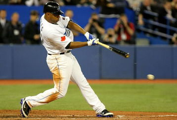 TORONTO - APRIL 6:  Vernon Wells #10 of the Toronto Blue Jays hits an RBI single against the Detroit Tigers in the 8th inning during their MLB game at the Rogers Centre April 6, 2009 in Toronto, Ontario.(Photo By Dave Sandford/Getty Images)
