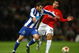 MANCHESTER, UNITED KINGDOM - APRIL 07:   Lisandro of FC Porto holds off the challenge of Carlos Tevez of Manchester United during the UEFA Champions League Quarter Final First Leg match between Manchester United and FC Porto at Old Trafford on April 7, 2009 in Manchester, England. (Photo by Alex Livesey/Getty Images)