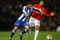 MANCHESTER, UNITED KINGDOM - APRIL 07:   Lisandro of FC Porto holds off the challenge of Carlos Tevez of Manchester United during the UEFA Champions League Quarter Final First Leg match between Manchester United and FC Porto at Old Trafford on April 7, 2009 in Manchester, England. (Photo by Alex Livesey/Getty Images)