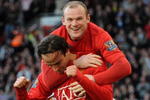 MANCHESTER, ENGLAND - APRIL 25:  Dimitar Berbatov of Manchester United is congratulated by team mate Wayne Rooney after scoring his team's fifth goal during the Barclays Premier League match between Manchester United and Tottenham Hotspur at Old Trafford on April 25, 2009 in Manchester, England.  (Photo by Shaun Botterill/Getty Images)