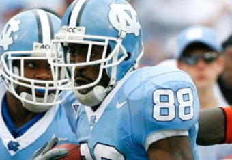 CHAPEL HILL, NC - OCTOBER 06:  Receiver Hakeem Nicks #88 of the North Carolina Tar Heels rushes away from defenders Willie Cooper #28 and Tavares Gooden #52 of the Miami Hurricanes during the second half at Kenan Stadium on October 6, 2007 in Chapel Hill, North Carolina.  North Carolina defeated Miami 33-27.  (Photo by Kevin C. Cox/Getty Images)