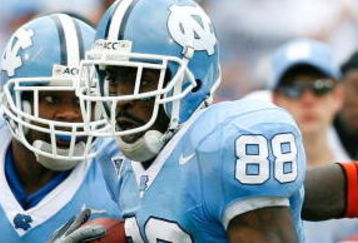 CHAPEL HILL, NC - OCTOBER 06:  Receiver Hakeem Nicks #88 of the North Carolina Tar Heels rushes away from defenders Willie Cooper #28 and Tavares Gooden #52 of the Miami Hurricanes during the second half at Kenan Stadium on October 6, 2007 in Chapel Hill, North Carolina.  North Carolina defeated Miami 33-27.  (Photo by Kevin C. Cox/Getty Images)