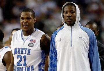DETROIT - APRIL 06:  Deon Thompson #21 and Ed Davis #32 of the North Carolina Tar Heels look on from the bench late in the second half before the Tar Heels 89-72 win against the Michigan State Spartans during the 2009 NCAA Division I Men's Basketball National Championship game at Ford Field on April 6, 2009 in Detroit, Michigan. Ginyard used a medical red-shirt this season after injury.  (Photo by Andy Lyons/Getty Images)