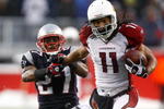 FOXBORO, MA - DECEMBER 21:  Ellis Hobbs #27 of the New England Patriots is unable to stop Larry Fitzgerald #11 of the Arizona Cardinals, who scored a touchdown on the run, at Gillette Stadium on December 21, 2008 in Foxboro, Massachusetts. The Patriots won 47-7. (Photo by Jim Rogash/Getty Images)