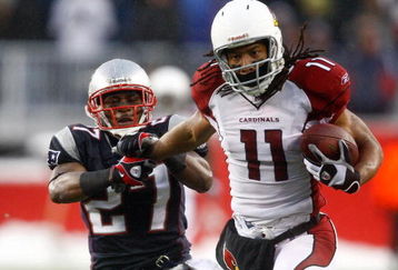 FOXBORO, MA - DECEMBER 21:  Ellis Hobbs #27 of the New England Patriots is unable to stop Larry Fitzgerald #11 of the Arizona Cardinals, who scored a touchdown on the run, at Gillette Stadium on December 21, 2008 in Foxboro, Massachusetts. The Patriots won 47-7. (Photo by Jim Rogash/Getty Images)
