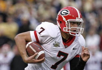 ATLANTA - NOVEMBER 24: Quarterback Matthew Stafford #7 of the Georgia Bulldogs rushes for a second quarter touchdown during the game against the Georgia Tech Yellow Jackets on November 24, 2007 at Bobby Dodd Stadium at Historic Grant Field in Atlanta, Georgia.  Georgia defeated Georgia Tech 31-17.  (Photo by Mike Zarrilli/Getty Images)