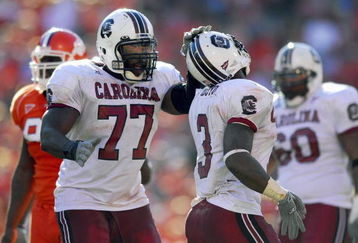 CLEMSON, SC - NOVEMBER 25:Jamon Meredith #77 of the South Carolina Gamecocks congratulates Cory Boyd #3 during the game against the Clemson Tigers at Memorial Stadium on November 25, 2006 in Clemson, South Carolina. South Carolina won 31-28. (Photo by Grant Halverson/Getty Images)