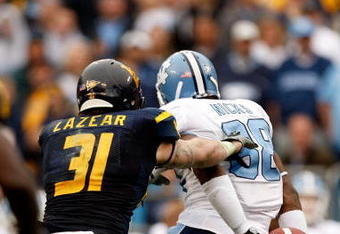 CHARLOTTE, NC - DECEMBER 27:  Hakeem Nicks #88 of the North Carolina Tar Heels catches a pass behind his back against  the West Virginia Mountaineers during the Meineke Car Care Bowl on December 27, 2008 at Bank of America Stadium in Charlotte, North Carolina.  (Photo by Streeter Lecka/Getty Images)