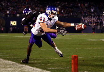 SAN DIEGO, CA - DECEMBER 23:  Runningback Ian Johnson #41 of the Boise State Broncos dives for the endzone pilon against the defense of Cornerback Rafael Priest #10 of TCU during the San Diego County Credit Union Poinsettia Bowl at Qualcomm Stadium on December 23, 2008 in San Diego, California. (Photo by Donald Miralle/Getty Images)