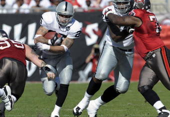 TAMPA, FL - DECEMBER 28: Running back Justin Fargus #25 of the Oakland Raiders rushes upfield against the Tampa Bay Buccaneers at Raymond James Stadium on December 28, 2008 in Tampa, Florida.  (Photo by Al Messerschmidt/Getty Images)