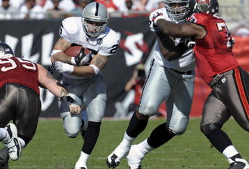 TAMPA, FL - DECEMBER 28: Running back Justin Fargus #25 of the Oakland Raiders rushes upfield against the Tampa Bay Buccaneers at Raymond James Stadium on December 28, 2008 in Tampa, Florida.  (Photo by Al Messerschmidt/Getty Images)
